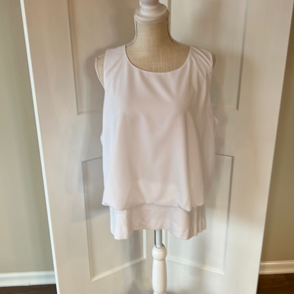 Cabi Top Fitted bottom with stretchy material and blousy top.